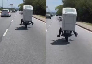 Motociclista transporta máquina de lavar (Foto: Reprodução)