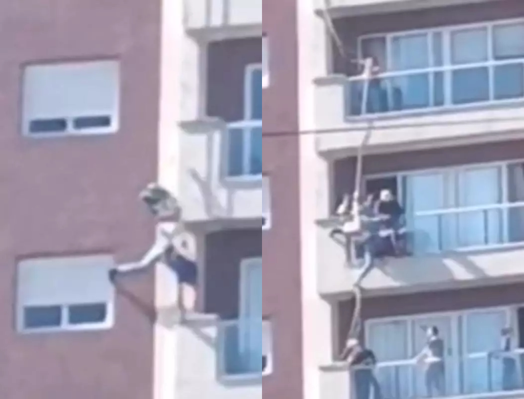 Homem fica pendurado em prédio (Foto: Reprodução)