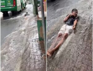 Vídeo mostra homem ‘deslizando’ em correnteza de alagamento durante temporal; ASSISTA!