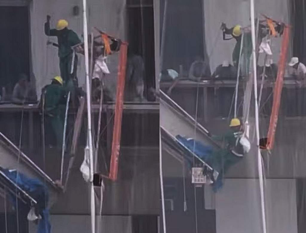Operário fica pendurado após andaime se soltar em prédio; VEJA VÍDEO