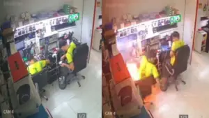 Homem estava sentado ao lado de um segundo funcionário de loja, quando o celular explodiu